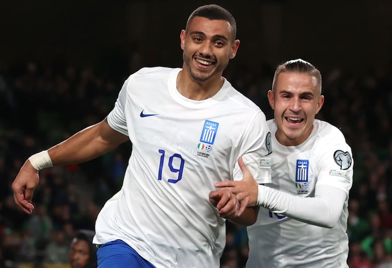 Greece’s Georgios Giakoumakis (left) celebrates scoring against Ireland last year .