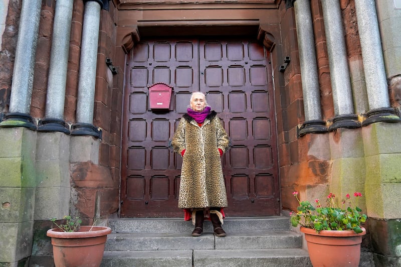 Terry Mckeown beside an archived picture of St Joseph's Church. PICTURE: JORDAN TREANOR