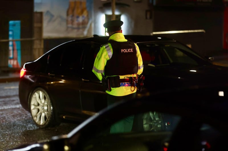 Police spoke with motorists on Tuesday as they returned to the scene of last week's murder. PICTURE: MAL MCCANN