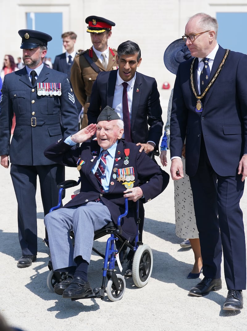 Prime Minister Rishi Sunak wheels D-Day veteran Bernard Morgan, 100, on the 80th anniversary of D-Day