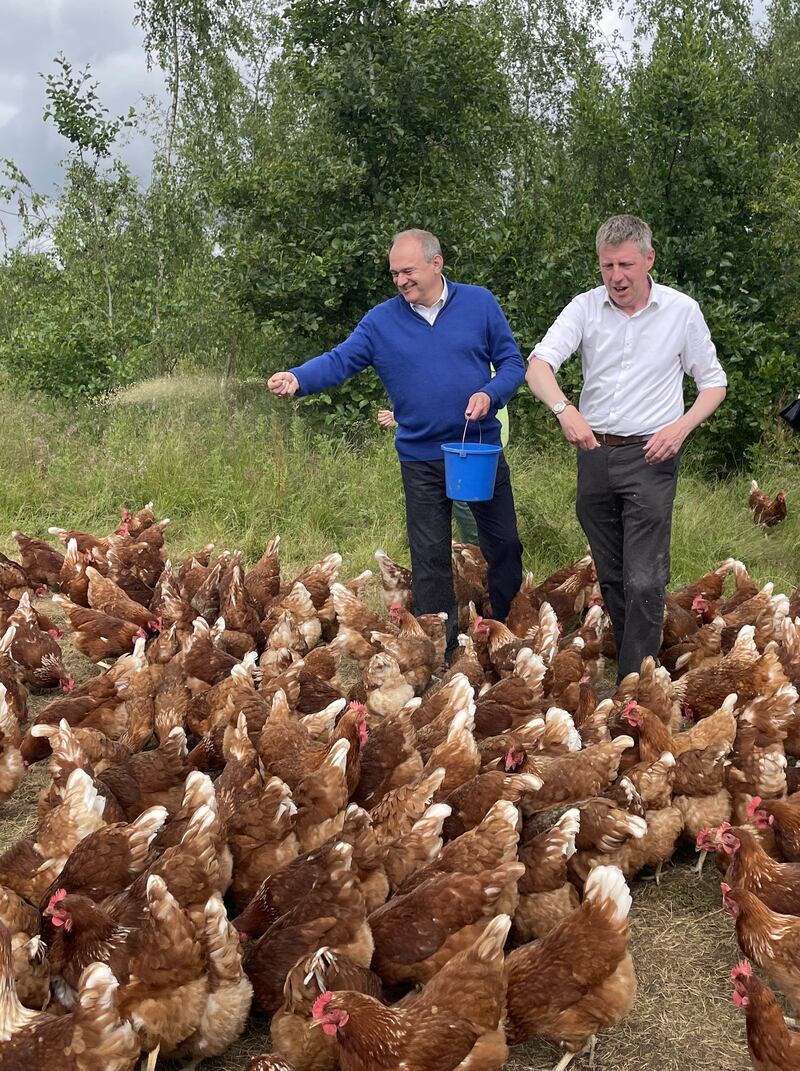 Liberal Democrat leader Sir Ed Davey, left, with Lib Dem candidate for Lewes James MacCleary during a visit to The Mac’s Farm in Ditchling, East Sussex