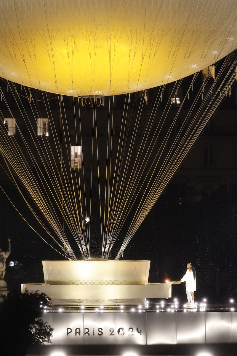 The Olympic flame in a hot air balloon