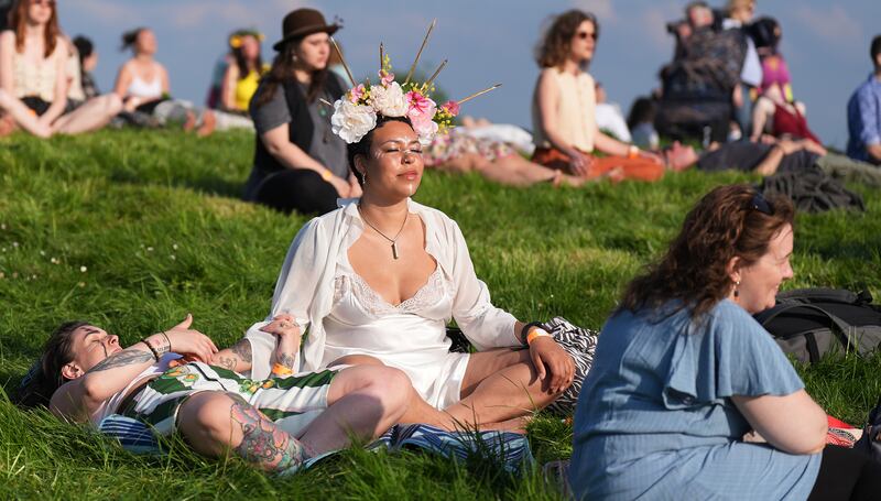 Jazz Smith, centre, meditates during the event on the Hill of Uisneach