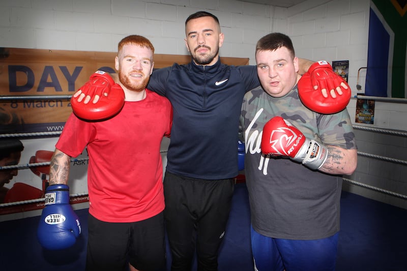 Frankie Carrothers with coach Dee Walsh and professional boxer Owen O'Neill at Gleann BC. Picture by Matt Bohill