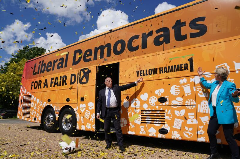 Liberal Democrat leader Sir Ed Davey, with local parliamentary candidate Pippa Heylings, at the launch of his party’s election battle bus at Whittlesford, Cambridge. on May 26