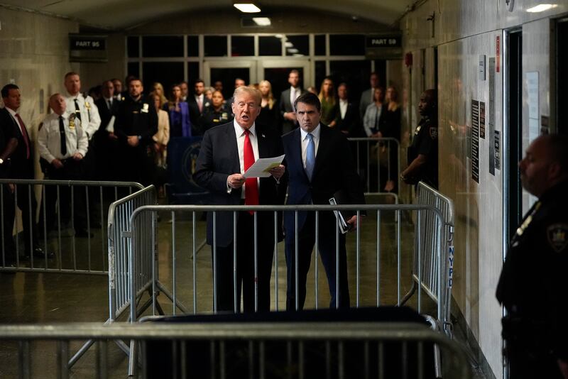 Donald Trump speaks to members of the media upon arriving at Manhattan Criminal Court in New York (Julia Nikhinson, Pool/AP)
