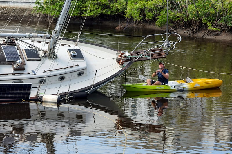 Tyler Griffin secures his boat in preparation for Hurricane Milton in Florida (Mike Carlson/AP)