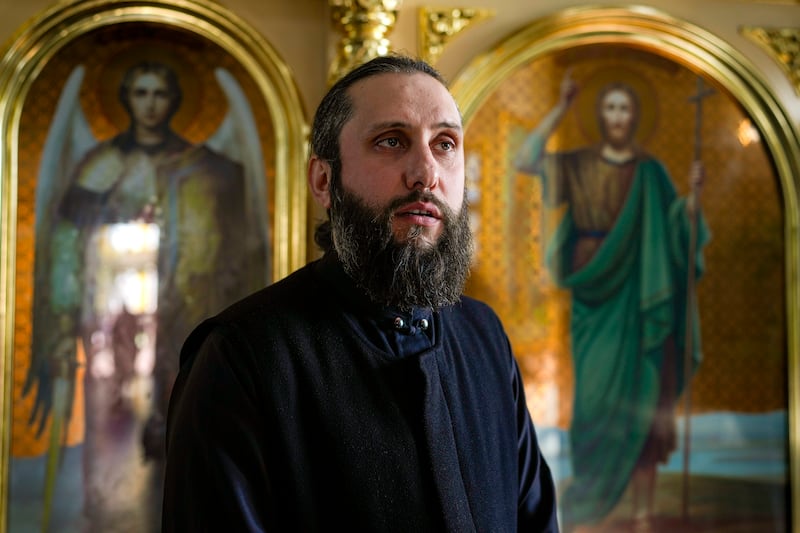 Father Vasilii speaks at the Saint John the Baptist cathedral in Comrat (Vadim Ghirda/AP)