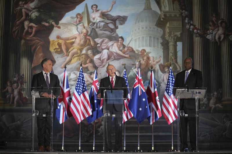 Defence Secretary John Healey (centre) speaks alongside US Secretary of Defence Lloyd Austin (right) and Australian Defence Minister Richard Marles