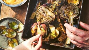 Grilled artichokes with hollandaise from Big Green Egg Feasts (Sam Folan/PA)