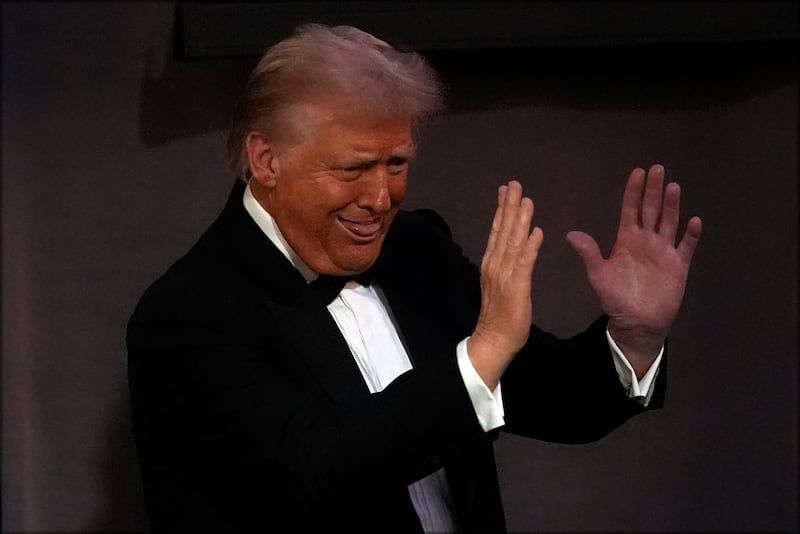 Republican presidential nominee former president Donald Trump gestures as he leaves the 79th annual Alfred E Smith Memorial Foundation Dinner in New York on Thursday (Julia Demaree Nikhinson/AP)