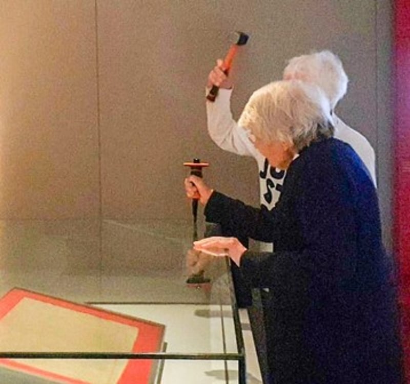 Judy Bruce, hidden, 85, and Reverend Sue Parfitt, 82, targeted the protective enclosure around the historic Magna Carta document