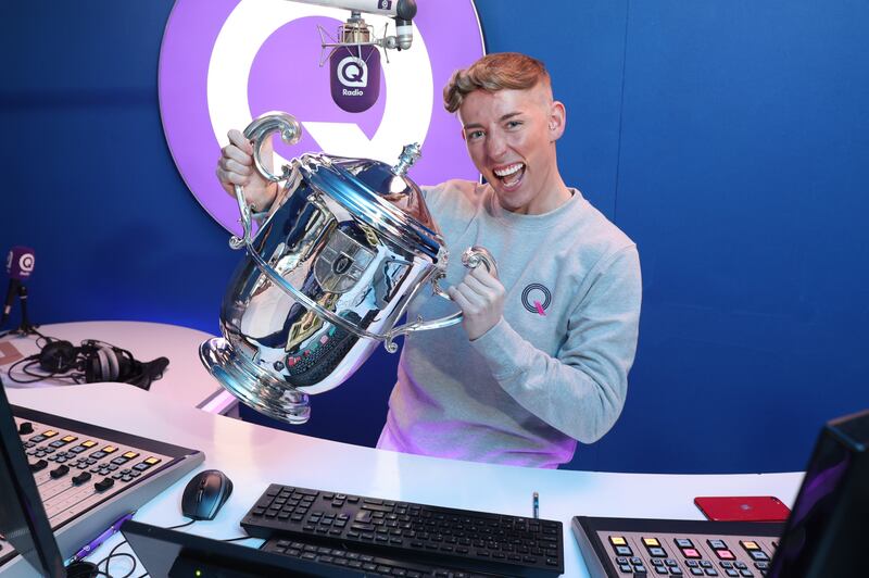 Q Radio presenter Gerry Lavz gets his
hands on the Anglo-Celt Cup