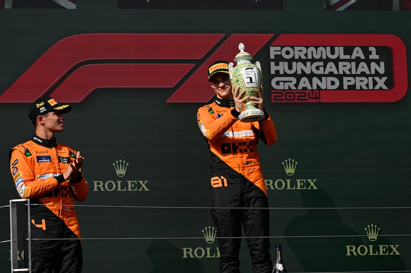 Oscar Piastri (right) celebrated on the podium with Lando Norris (Denes Erdos/AP)