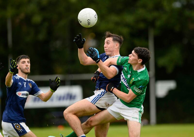 St Gall's man Niall Burns and Ciaran Maginnis of Aghagallon battle for the ball.