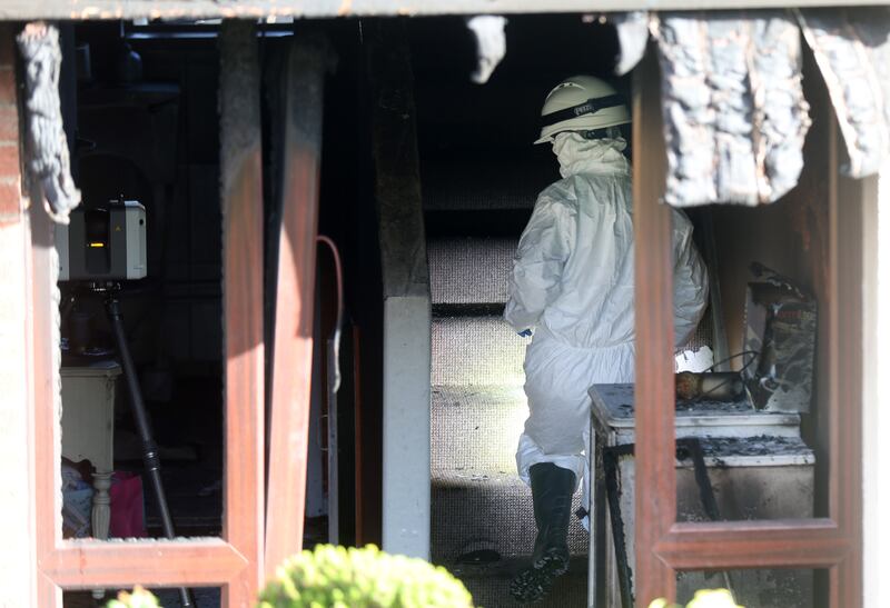 Forensics at the scene  of a house fire in the Cunninghams Lane area of Dungannon.
PICTURE COLM LENAGHAN