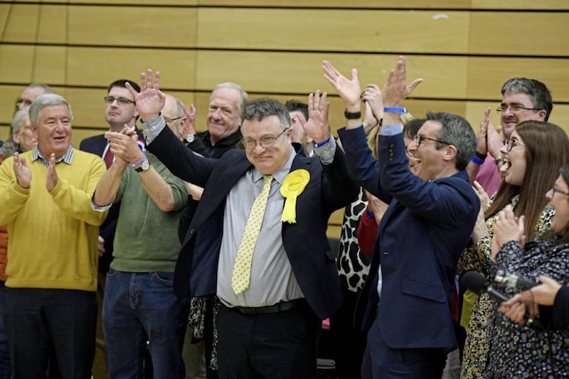 Stephen Farry of the Alliance Party celebrates with supporters after he won in North Down. Picture by Michael Cooper, Press Association 