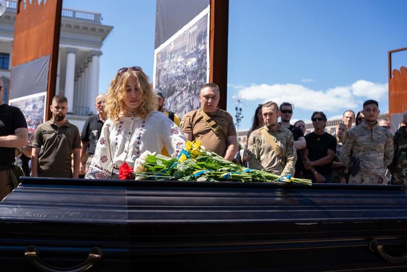 Peter Fouche’s partner during the ceremony (Alex Babenko/AP)