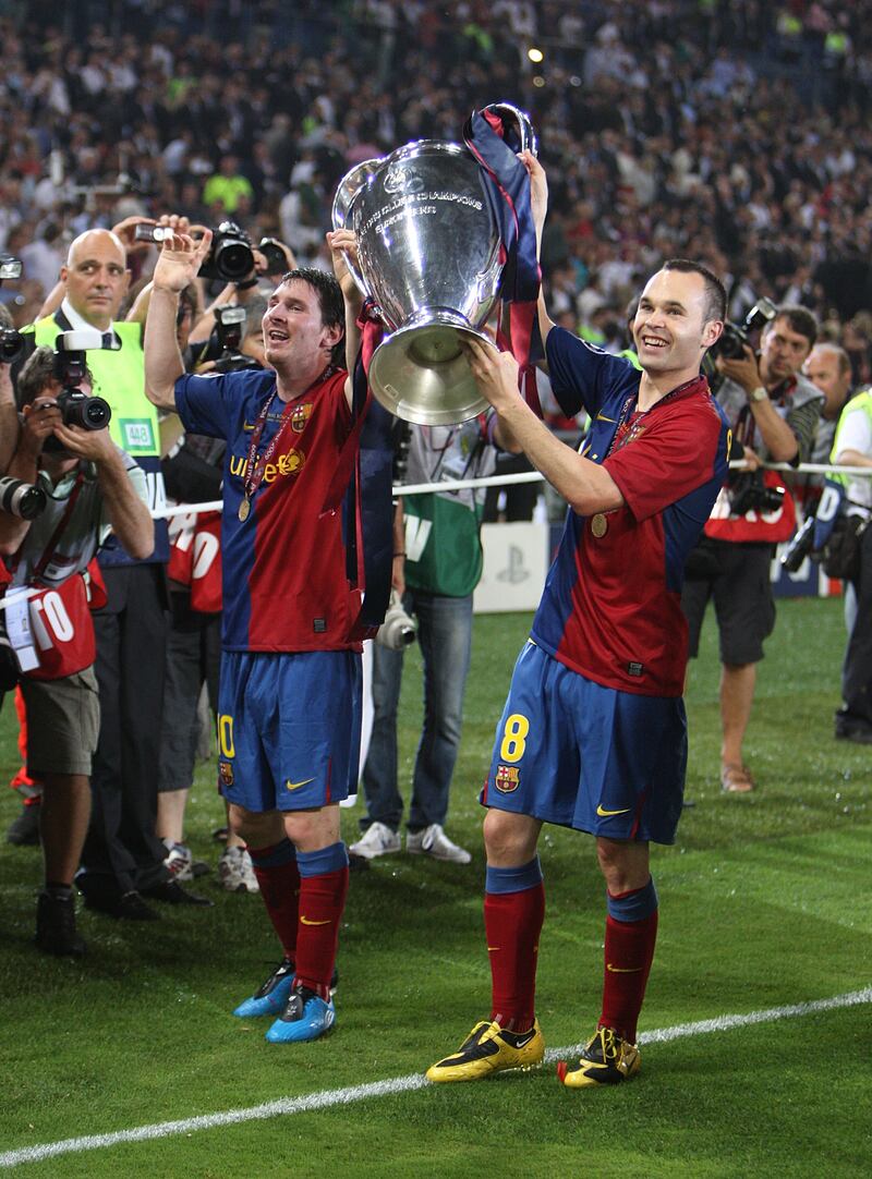 Andres Iniesta (right) and Lionel Messi celebrate beating Manchester United in the 2009 Champions League final