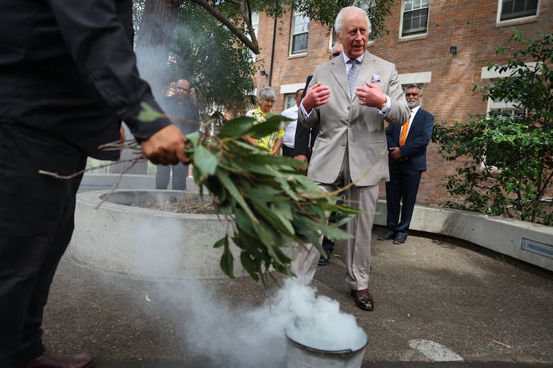 King Charles III participates in a smoking ceremony, during a visit to the National Centre of Indigenous Excellence in Sydney to meet Aboriginal and Torres Strait Islander community representatives