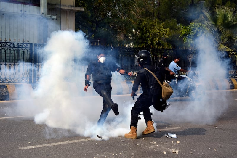 Police fire tear gas to disperse supporters of Khan’s party Pakistan Tehreek-e-Insaf, during a protest in Islamabad on Saturday (W.K. Yousafzai/AP)