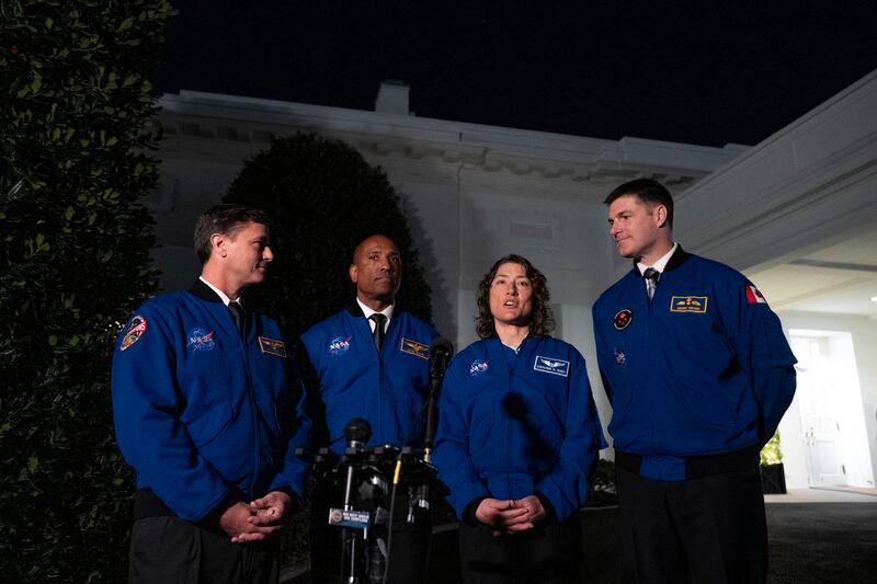 Artemis II crew members, from left, Reid Wiseman, Victor Glover, Christina Hammock Koch, and Jeremy Hansen speak to members of the media outside the West Wing of the White House in Washington on Thursday (Andrew Harnik/AP)