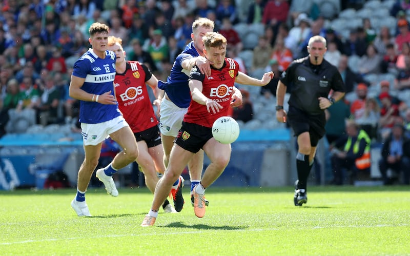 Down’s Liam Kerr and Laois’s Niall Dunne during Saturday’s Tailteann Cup Final at Croke Park in Dublin.
PICTURE COLM LENAGHAN