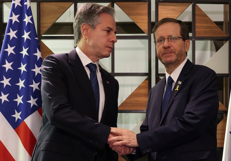 US Secretary of State Antony Blinken, left, meets with Israel’s President Isaac Herzog, in Tel Aviv, Israel (Kevin Mohatt/AP)