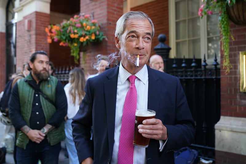 Reform UK leader Nigel Farage with a cigarette and a pint in central London