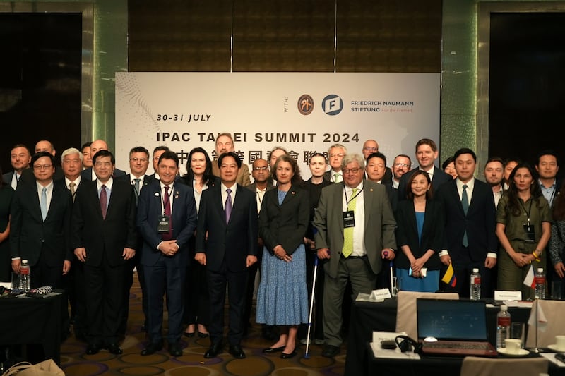 Taiwanese President Lai Ching-te, centre left, poses for photos at a gathering of the largest delegation of foreign politicians to visit Taiwan in Taipei (AP Photo/Dake Kang)