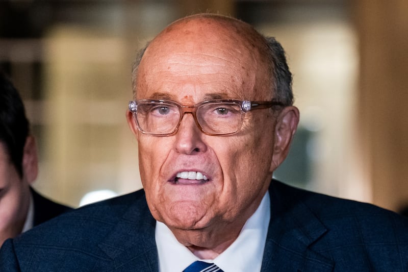 Rudy Giuliani speaking to the media outside court in New York (Adam Gray/AP)