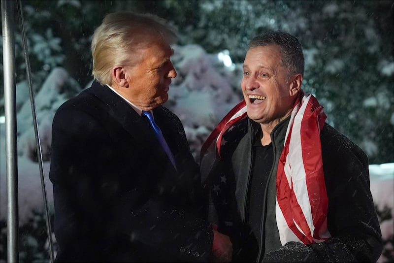 President Donald Trump greets Marc Fogel on the South Lawn at the White House (Evan Vucci/AP)