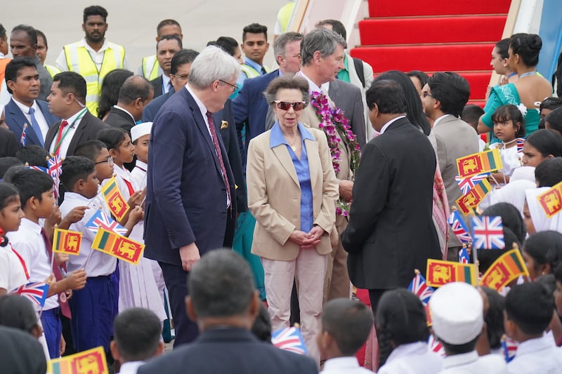 The Princess Royal and Vice Admiral Sir Tim Laurence are greeted by Andrew Patrick (left), British High Commissioner to Sri Lanka