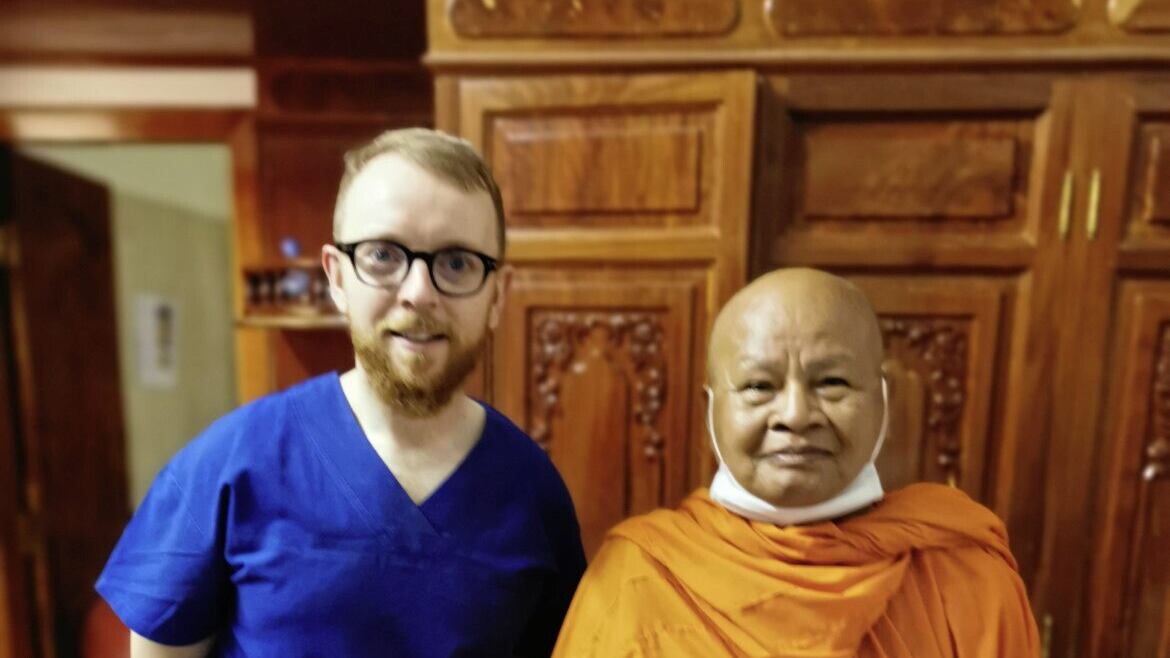 Shane Higgins, clinical lead optometrist at Kingsbridge Private Hospital, pictured with a Buddhist monk who was a cataract patient of the Northern Ireland team of eye specialists who volunteered in Cambodia