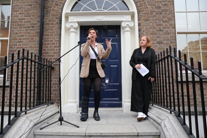 Natasha O’Brien (left) addresses protesters outside Leinster House in Dublin