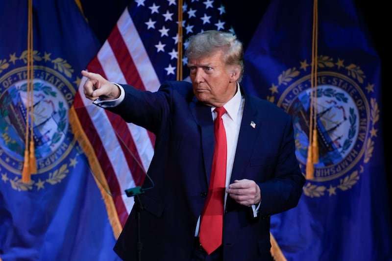 Mr Trump pointing to members of the audience during a campaign event in Rochester, New Hampshire, on Sunday (Charles Krupa/AP)