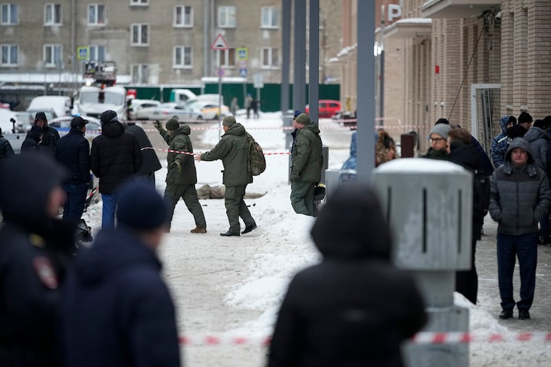 Investigators work at the scene in Moscow (AP)