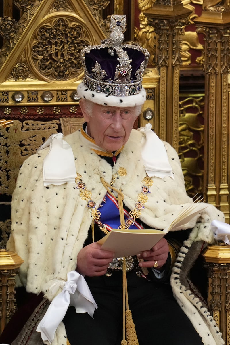 Charles looks up as he reads the King’s Speech, during the State Opening of Parliament