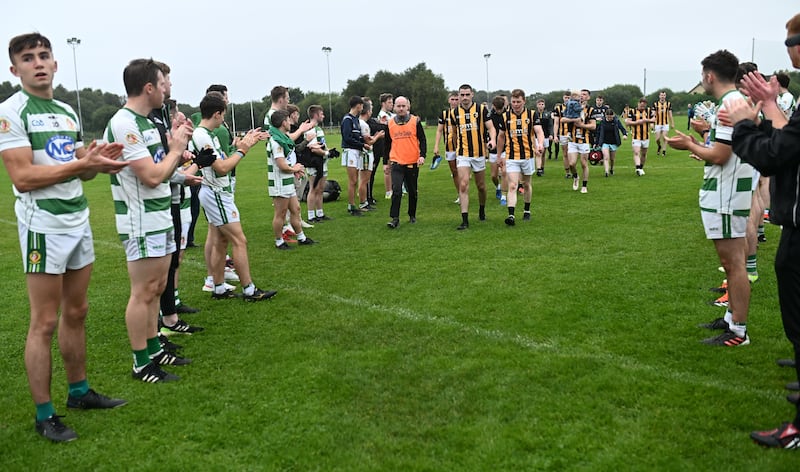 Sarsfields players applaud Crossmaglen Rangers off the field at the end of the championship match. Picture: Sportsfile