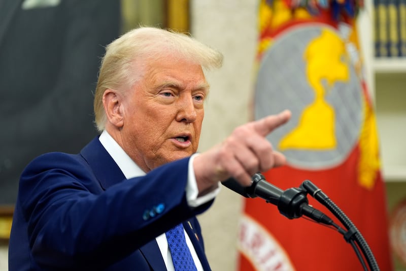 President Donald Trump speaks as Tulsi Gabbard is sworn in as the director of National Intelligence (Alex Brandon)