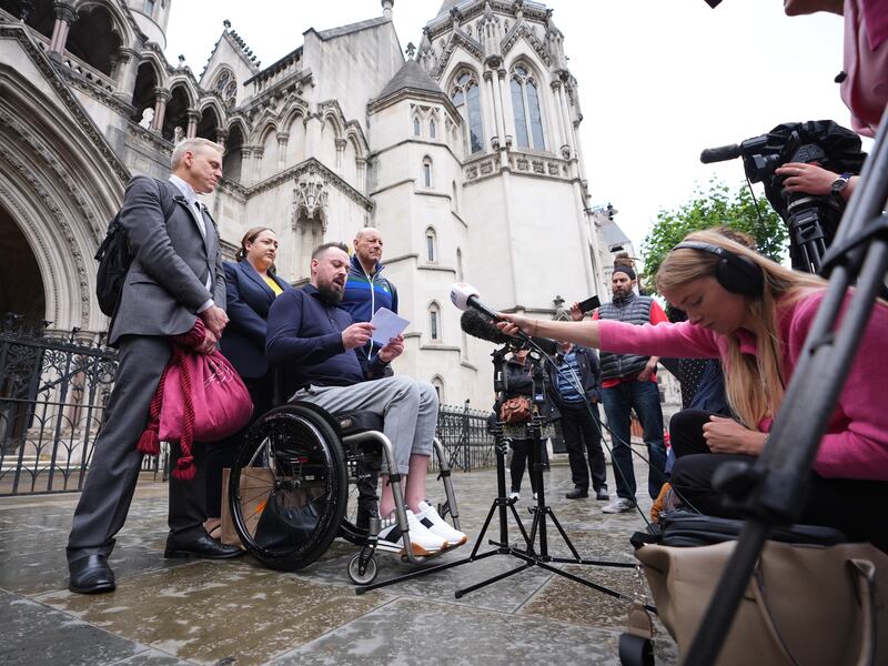 Martin Hibbert (centre) after a previous hearing in the case