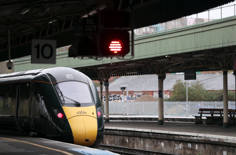 A Great Western Railway train waits on a platform at Bristol Temple Meads station