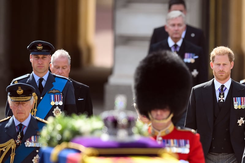 The King, the Prince of Wales and the Duke of Sussex follow the coffin of the late Queen