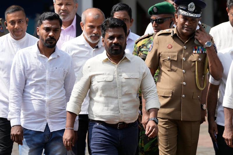 Sri Lankan President Anura Kumara Dissanayake leaves after casting his vote during the parliamentary election in Colombo (AP/Eranga Jayawardena)