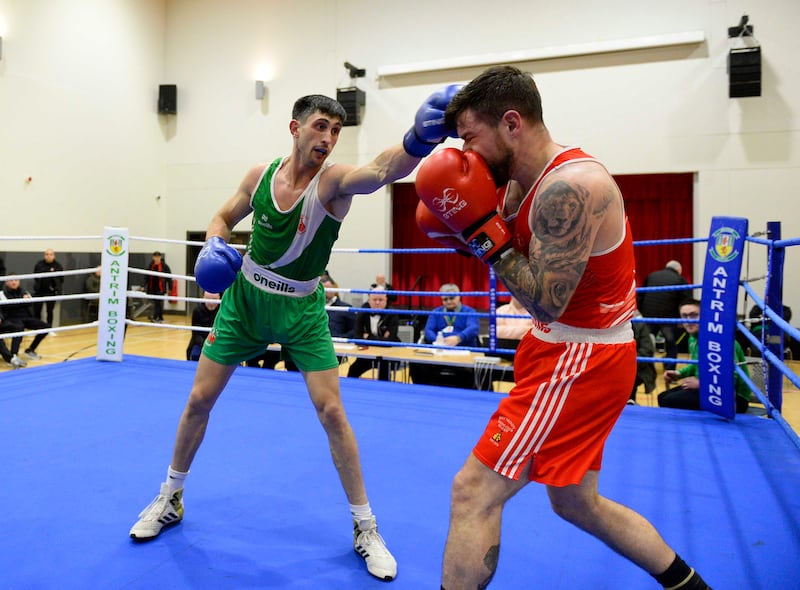 Lex Weston [Blue corner] and Karl McCrystal [red]  during the 75KG bout at the Ulster Elite semi finals at Girdwood community hub in Belfast.  Picture Mark Marlow