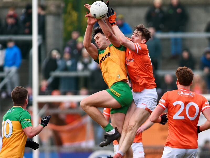 Andy Murnin and Michael Langan compete for a kickout during Armagh's draw with Donegal. Picture: John Merry