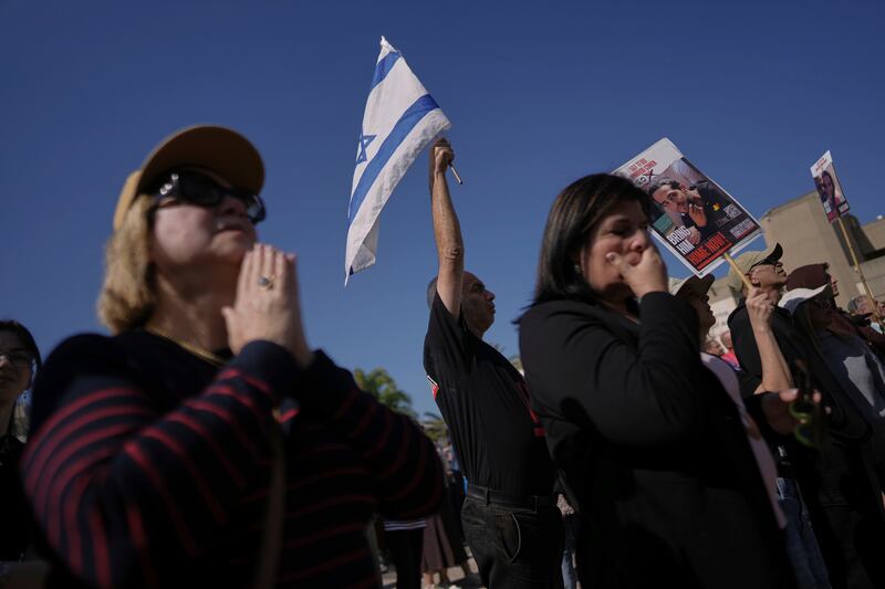 The three men have now crossed the border back to Israel (AP)