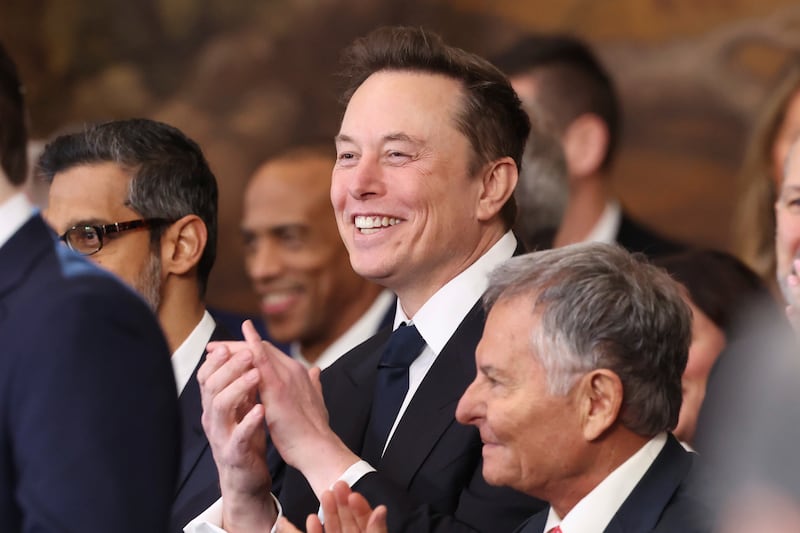 Elon Musk listens as President Donald Trump speaks after taking the oath of office at the 60th Presidential Inauguration (Kevin Lamarque/AP)