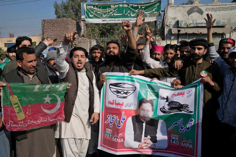 Supporters of Pakistan’s imprisoned former prime minister Imran Khan’s party block a road during a protest (AP Photo/K.M. Chaudary)