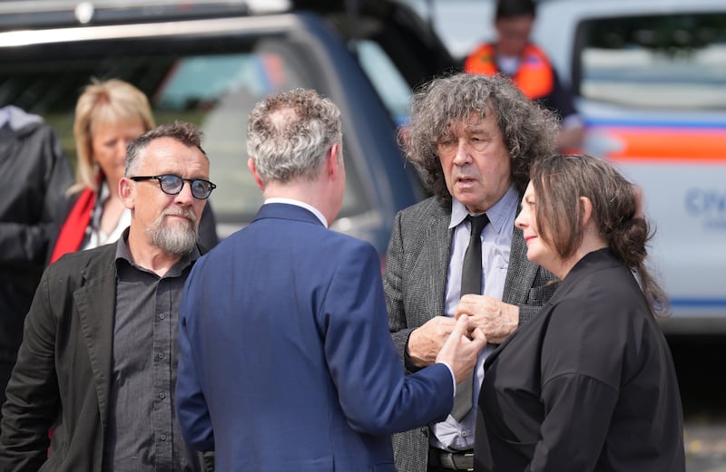 Actor Stephen Rea (second right) at Mountshannon ahead of the burial